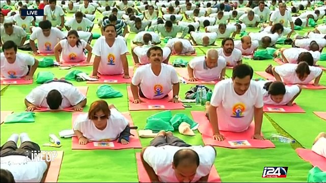 Yoga Day: people around the world stretch in unexpected places