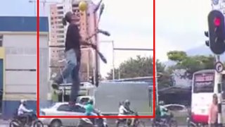 Talented Street Juggler Entertains During Red Light