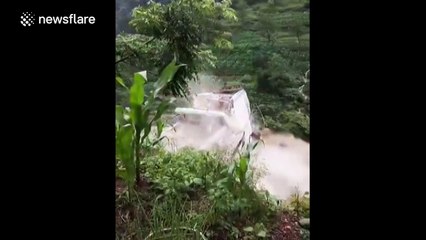 Three-storey house washed away by swollen river