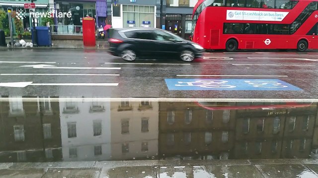Bus lanes flooded in Clapham, London after major overnight storms