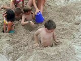 Isaac Jon and some kids trying to get out from buried in the sand July 10