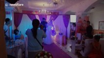 Sparklers set bride's wedding dress on fire during ceremony
