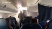 'Unruly' passenger is escorted out of plane by police