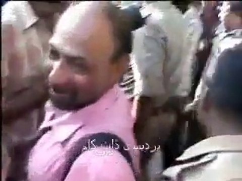 Indian People tease woman stuck in the concrete at road