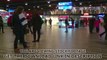 People in busy railway station. Passengers waiting for train, checking timetable. Stock Footage