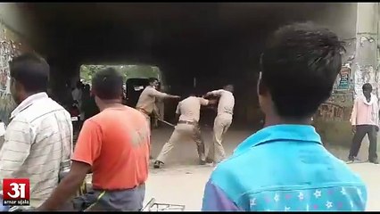 Police personnel fighting each other for bribe money