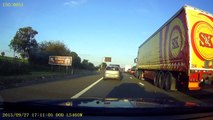 Eastbound M4, Bentley passing queue on hard shoulder.