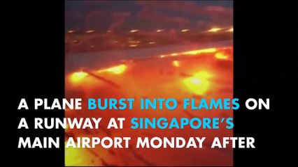 Plane bursts into flames on Singapore runway, no casualties