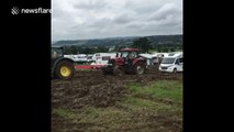 Tractor pulling a tractor pulling a campervan gets stuck at Glastonbury