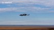 Helicopters fly backwards at Armed Forces Day in Cleethorpes, UK