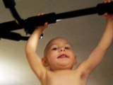 2 year old  baby doing 10 reps on pull up bar