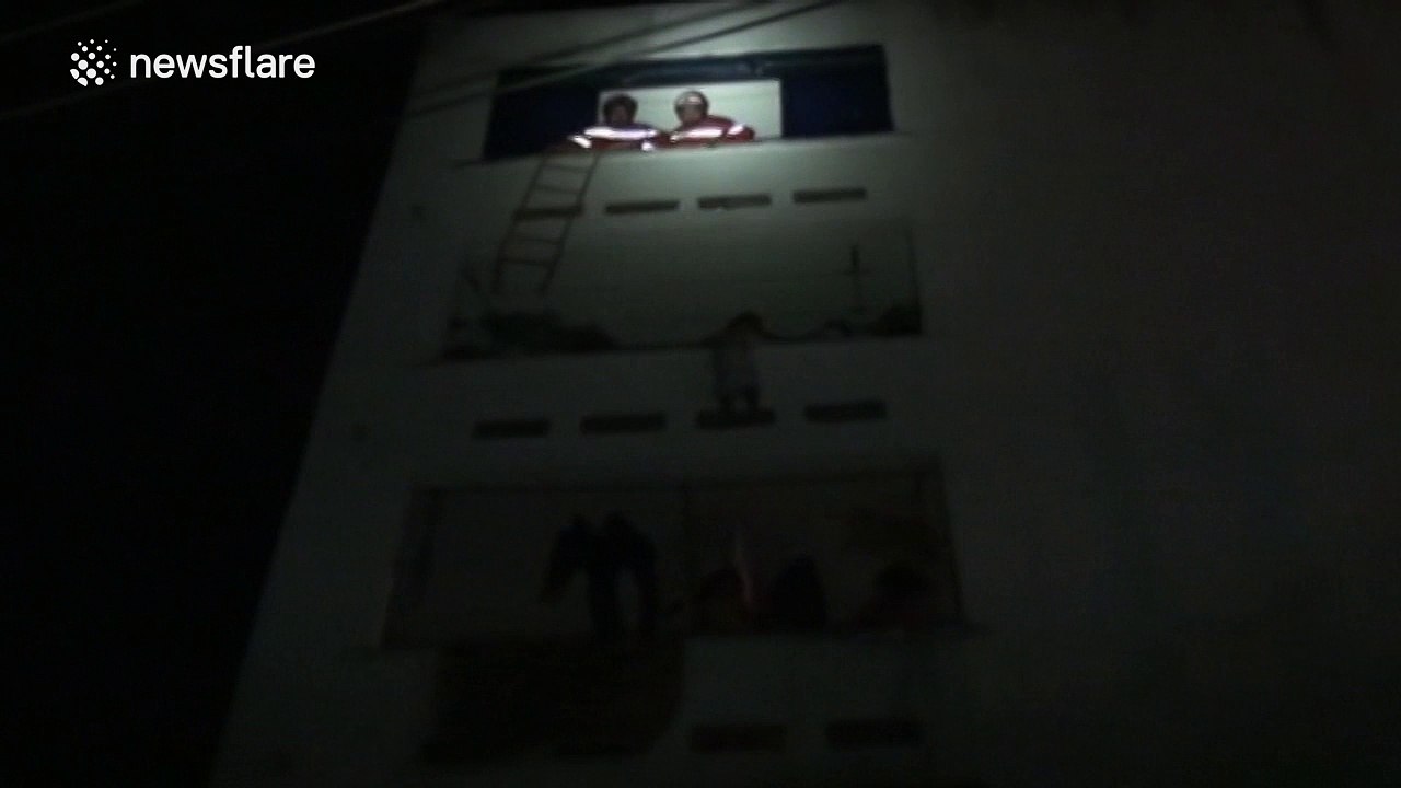 Firefighters rescue boy stuck on a balcony