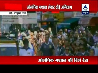 Megastar Amitabh Bachchan carries Olympic torch in London