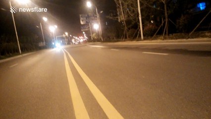 Girls take selfies in the middle of road in China