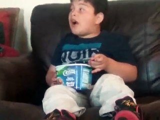Fat kid eating ice cream from the  box