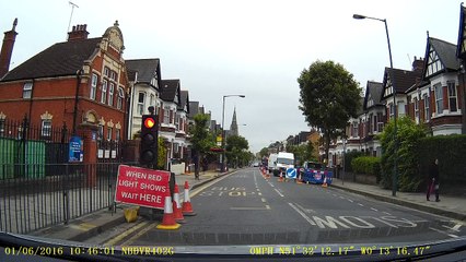 Dashcam video 13 - Young girl runs out into the roadworks.