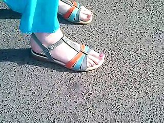 candid feet in sandals with long toes in bus station CAM04256