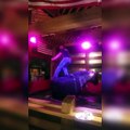 guy rides mechanical bull standing up
