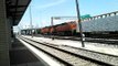 BNSF frieght train pulls outta station & Trinity Railway Express