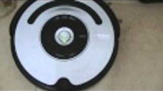 Roomba IRobot 560 goes for a charge docking back after cleaning around