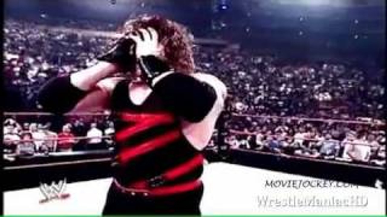 Kane Removes His Mask and show His Burning face
