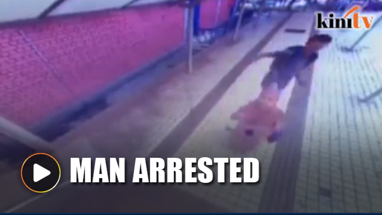 Cowardly man kicks woman from behind near Bank Negara