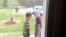 Little girl pulls little boy in for kisses before they se...