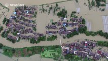 Aerial footage of floods swamping villages in southern China