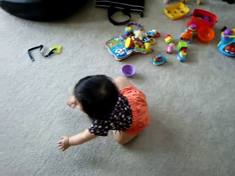 10 month old baby plays with cat