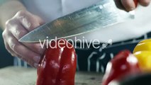 Chef Cutting Red Pepper on Kitchen Table - Stock Footage | VideoHive 15200652