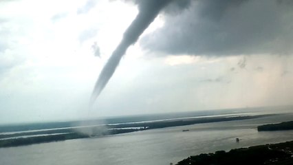 Waterspout Swirling Near Crane Operator