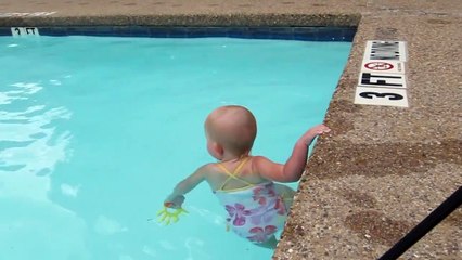 Toddler swims solo in the pool