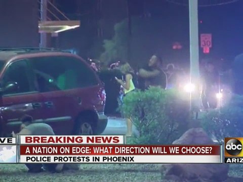 RAW VIDEO: Protestors throw objects at officers in Phoenix