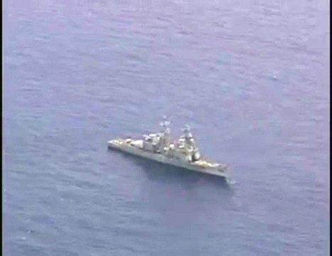A torpedo hits a decomissioned U.S. Navy ship during RIMPAC