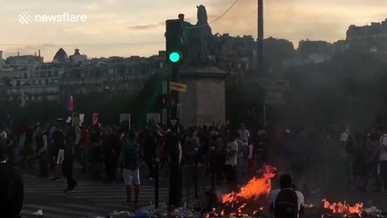 Riot police charge at football supporters in Paris