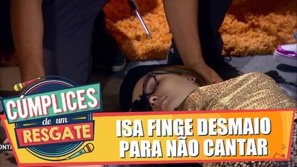 Isa finge desmaio para não cantar