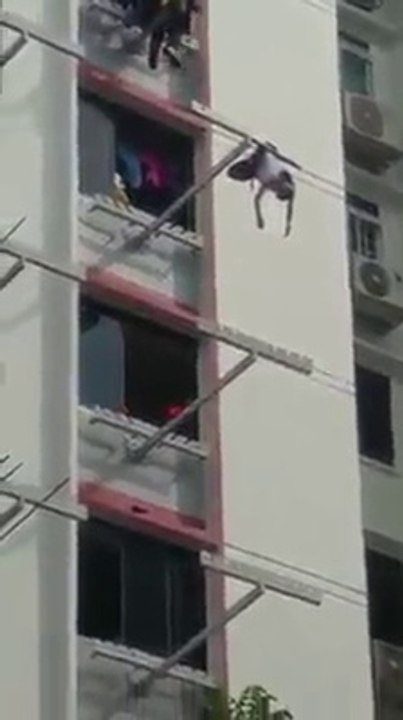Rescuing a Man Hanging Outside Windows on 8th Floor