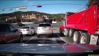 Dump truck barrels through red light, smashes cars