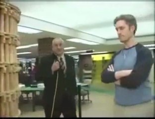 Clumsy Reporter Knocks Down Jenga Tower