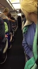 "You're stepping on my hair!" Drunk girl gets dragged off of plane