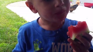 Young Kid (child) Just Woke Up Having Fun With a Serious, Funny Water Melon Mess