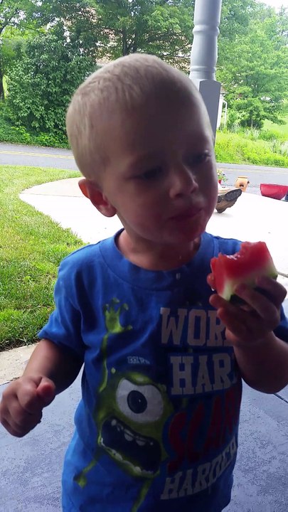 Young Kid (child) Just Woke Up Having Fun With a Serious, Funny Water Melon Mess