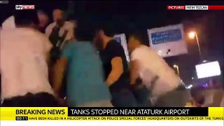 Turkey Protesters Climb Onto Tank Near Istanbul's Ataturk Airport