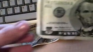 How to find the Twin Towers on 5 and 20 dollar bill.