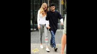 Gigi Hadid and Zayn Malik look absolutely besotted as they walk hand-in-hand in New York
