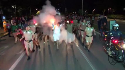 protester tried to extinguish the Olympic flame with a fire extinguisher in Brazil