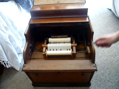 Celestina 20 note paper roll organ plays The Mikado