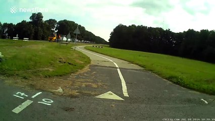 Car driver mistakes cycle path for road