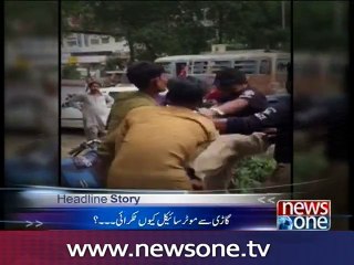 Police beat two young men who hit the Police car in Karachi
