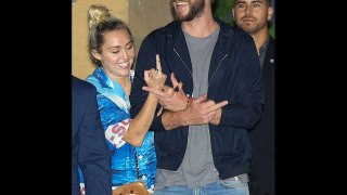 Miley Cyrus and Liam Hemsworth flip off the paparazzi while on dinner date